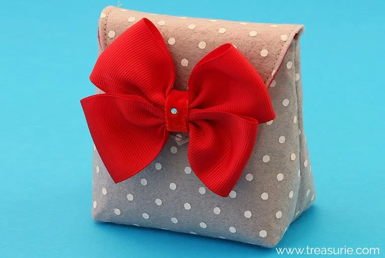 Image of gray felt gift bag with red ribbon bow