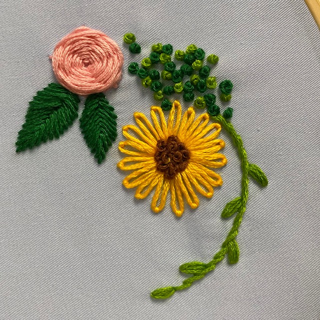 Embroidered rose and sunflower with leaves 