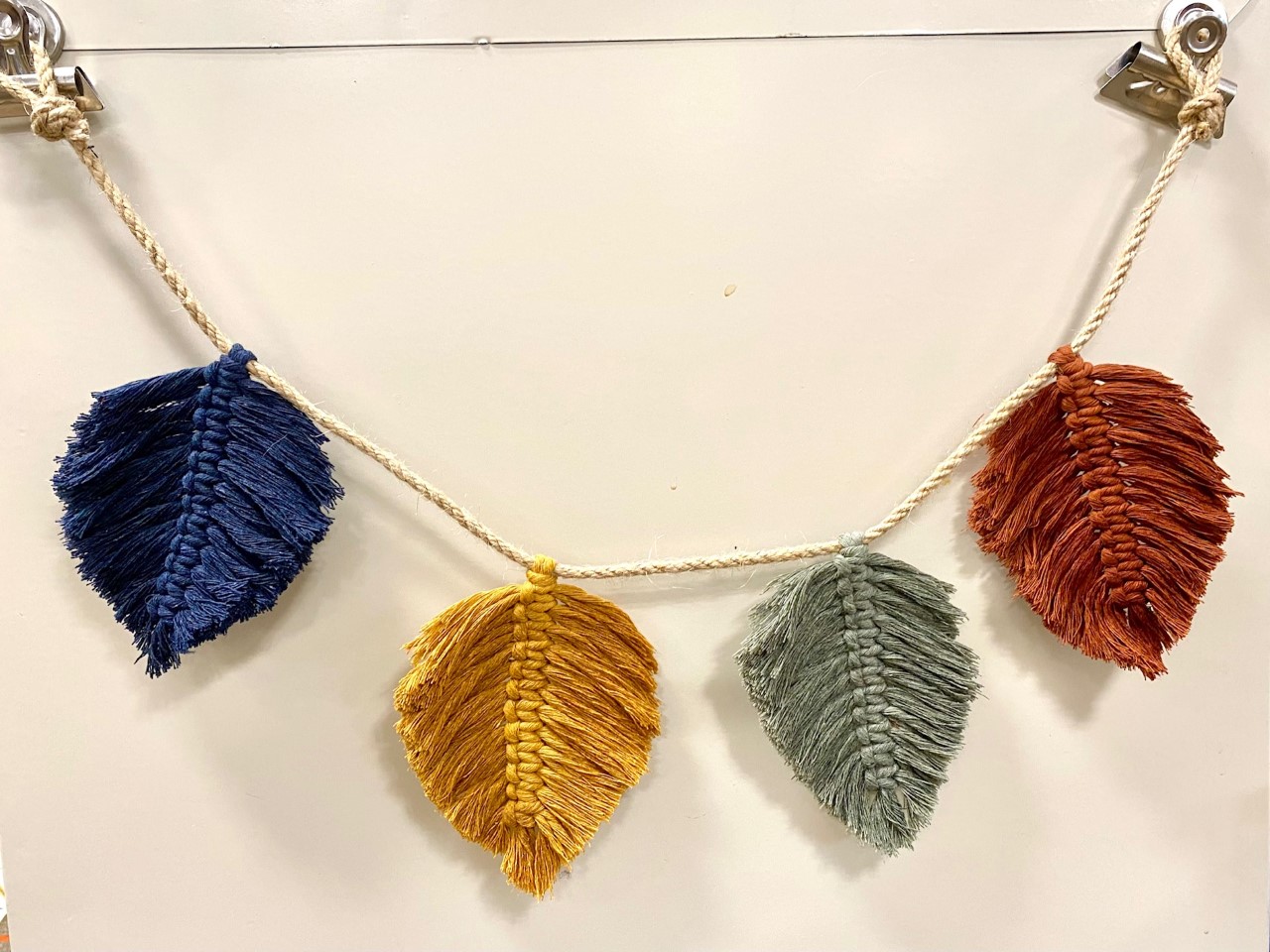 garland with macrame leaves in blue, yellow, green, orange