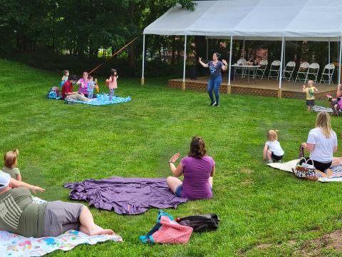 Image of an outdoor music and movement program at the library