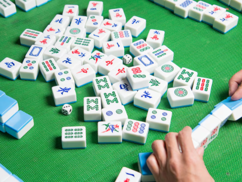 Mahjong tiles on a green background