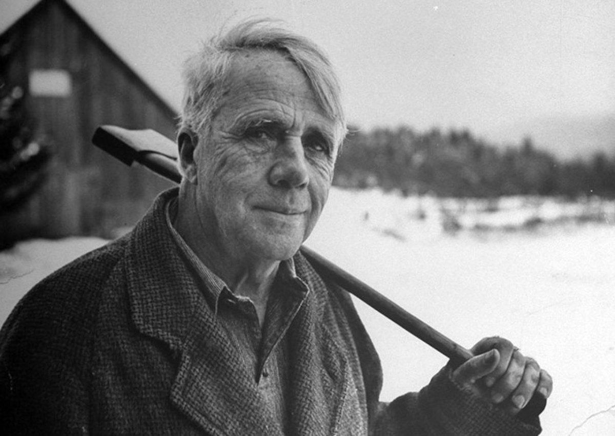 Robert Frost carrying an axe