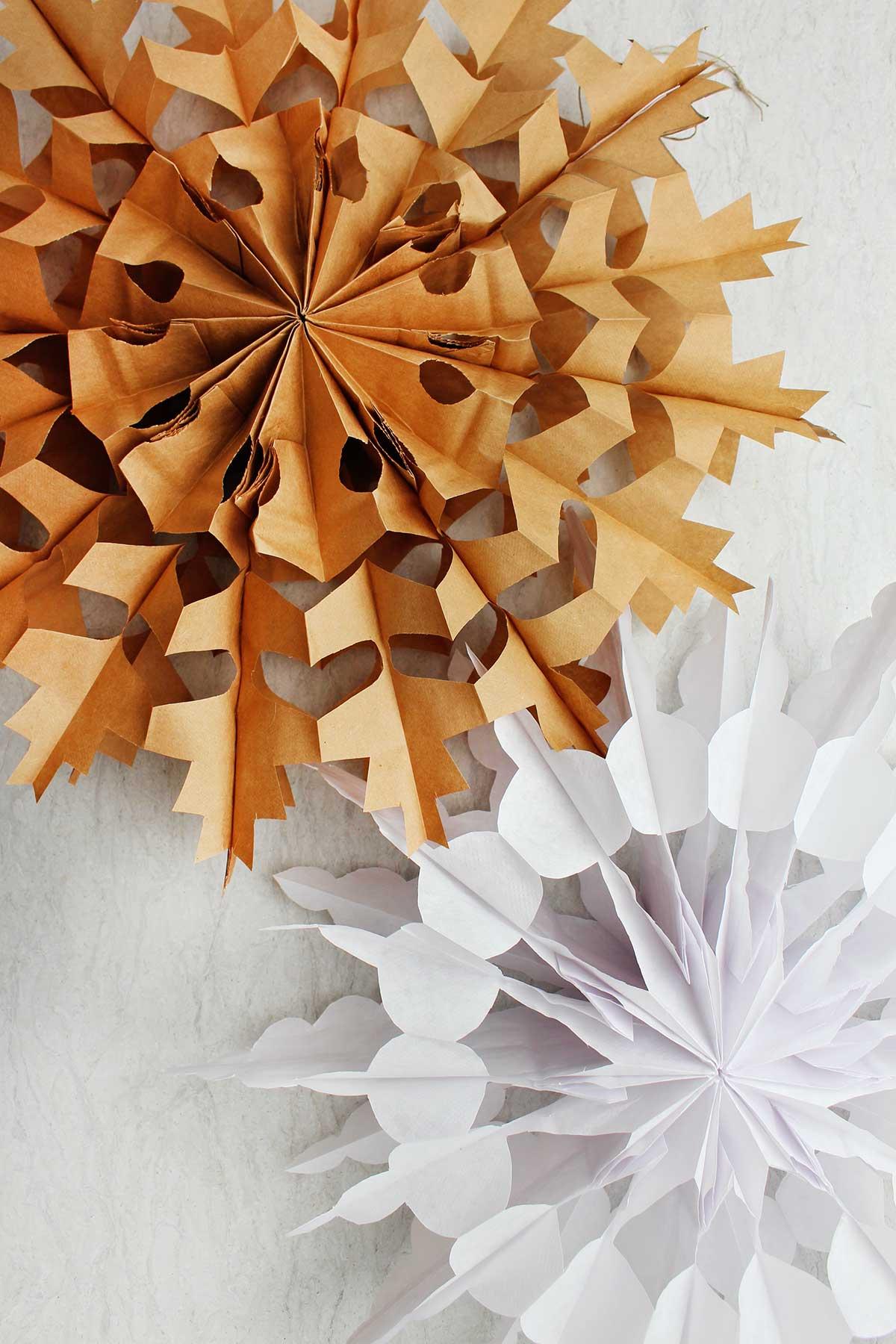 photo of brown and white paper bag snowflakes